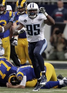 St. Louis Rams quarterback Kellen Clemens, left, fumbles as Tennessee Titans defensive end Kamerion Wimbley reaches for the ball during the fourth quarter of an NFL football game Sunday, Nov. 3, 2013, in St. Louis. The Titans Derrick Morgan recovered the fumble. (AP Photo/Jeff Roberson)