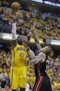 Indiana Pacers center Roy Hibbert, left, shoots over Miami Heat forward Chris Andersen during the fourth quarter of Game 2 of the NBA basketball Eastern Conference finals in Indianapolis, Tuesday, May 20, 2014. The Heat defeated the Pacers 87-83 to tie the series at 1-1. (AP Photo/Michael Conroy)