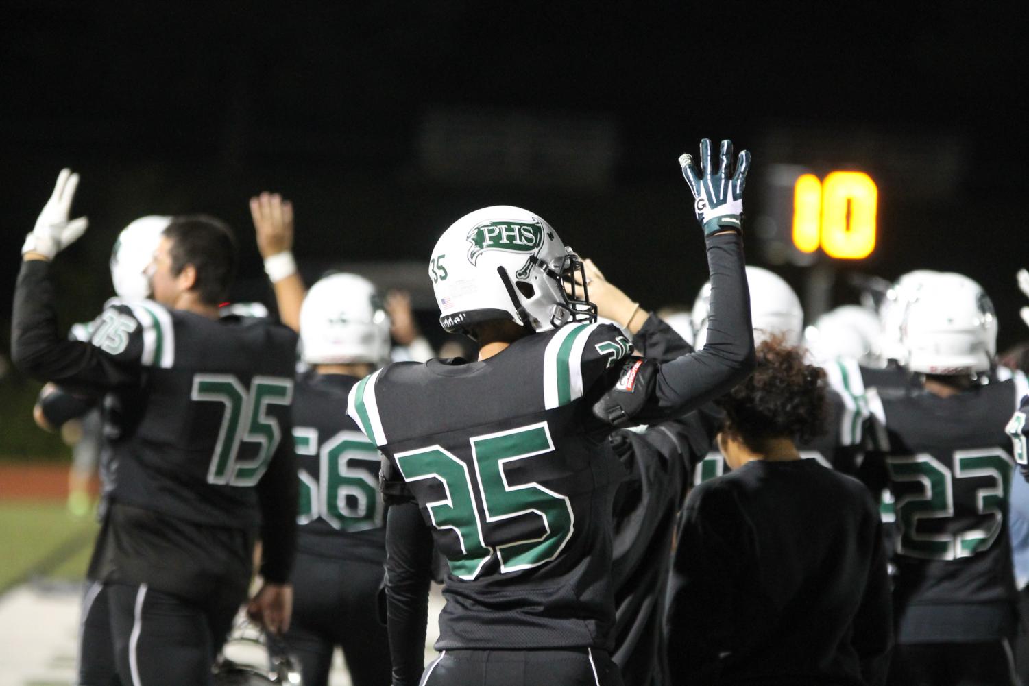 Jacob Whittinghill (35) is playing in his fourth season of football with Pattonville High School. He holds up four fingers as the Pirates start the 4th quarter against Kirkwood on Sept. 21.