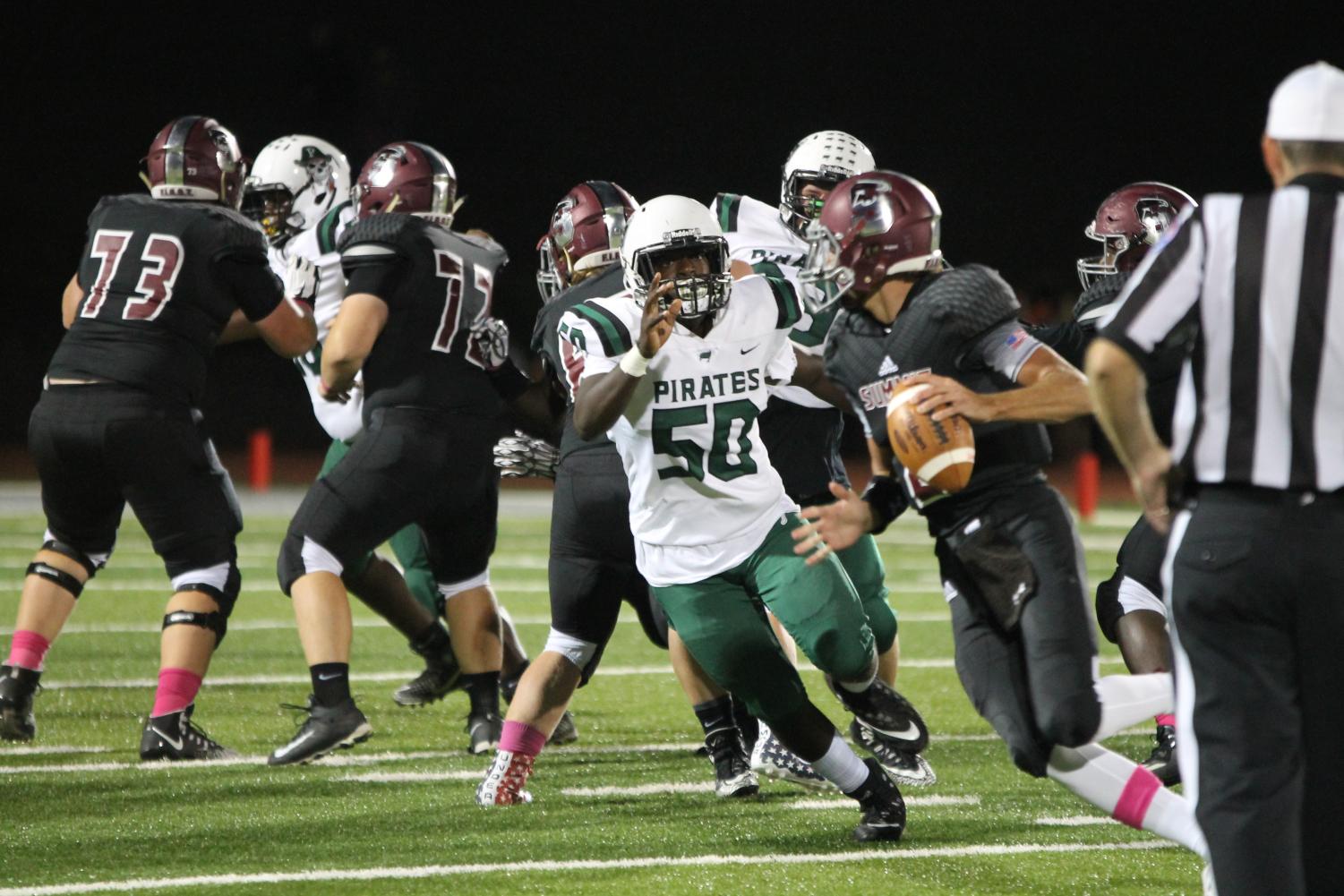Pattonville’s senior OL/DE Darrion Robinson chases down the Rockwood Summit
quarterback. The Pirates defeated the Falcons 42-14.