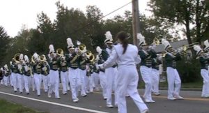 The marching band participates in the Homecoming parade. (file photo)