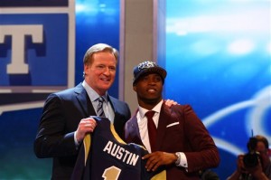 Tavon Austin, from West Virginia, stands with NFL Commissioner Roger Goodell after being selected eighth overall by the Saint Louis Rams in the first round of the NFL football draft, Thursday, April 25, 2013, at Radio City Music Hall in New York. (AP Photo/Nat Castaneda)