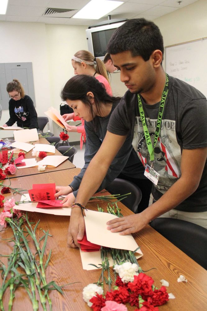 SLIDESHOW Student Council prepares carnations for distribution