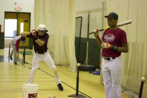 The baseball team was forced to stay inside during the early parts of tryouts because of the weather. 