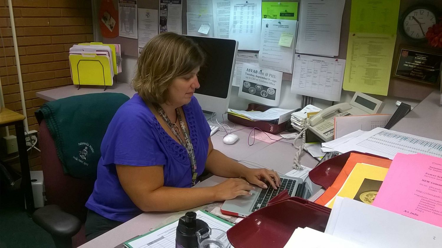 Krohn completing work at her desk.