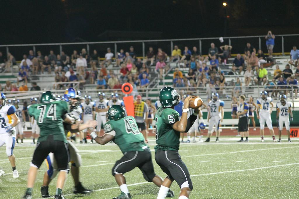 Freshman quarterback Kaleb Eleby throws for a completion in a game against Seckman High School.