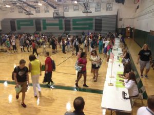 A line forms in the gym on Wednesday morning as students pick up their updated schedules. 
