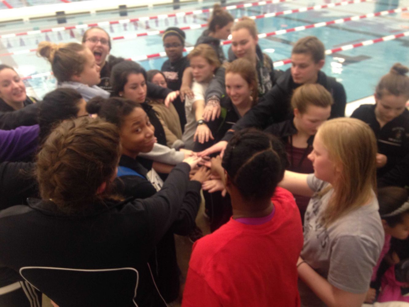 The team rallied together before leaving the meet to do their team chant one last time. 