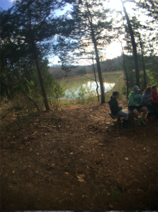 5th graders are sitting by the lake learning something new. Photo: Courtesy of Rene Greenwell