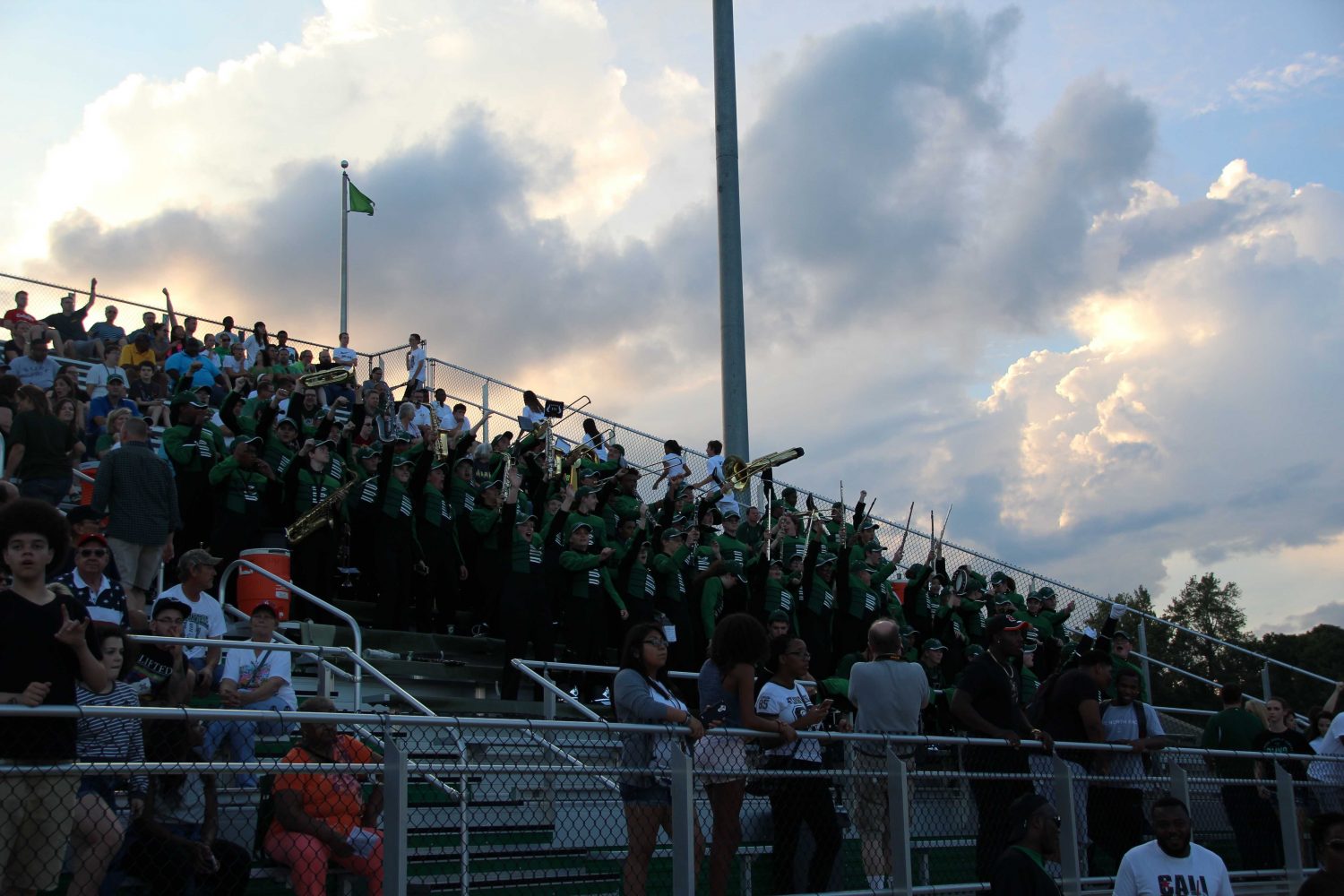 The marching band sits in the stands during a football game at Pattonville Stadium.