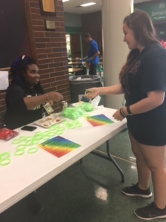 Gay Straight Alliance club selling bracelets on National Coming Out Day