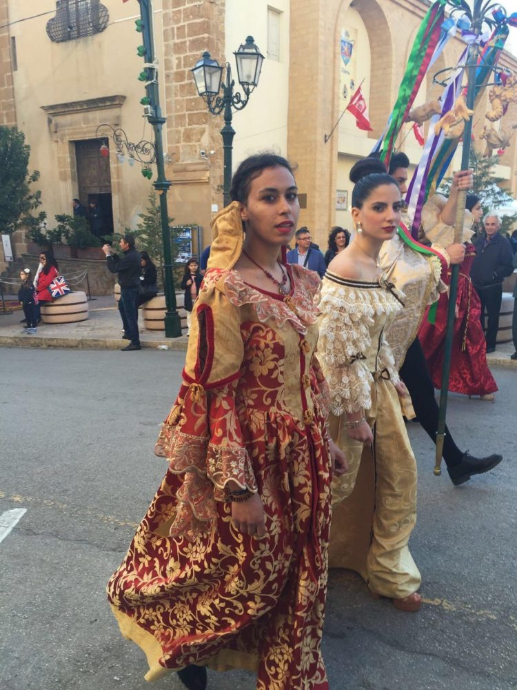 Oddo wears a traditional, Renaissance styled dress in a saint festival at her hometown of Sambuca di Sicilia. 