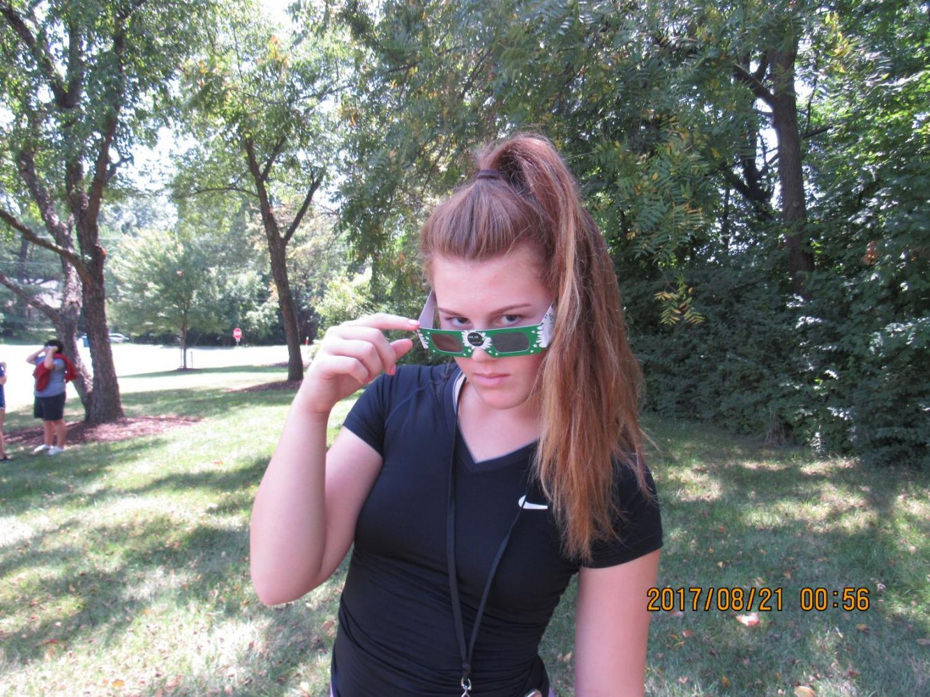 Student Natalie Wildberger shows off the Pattonville exclusive solar eclipse glasses.