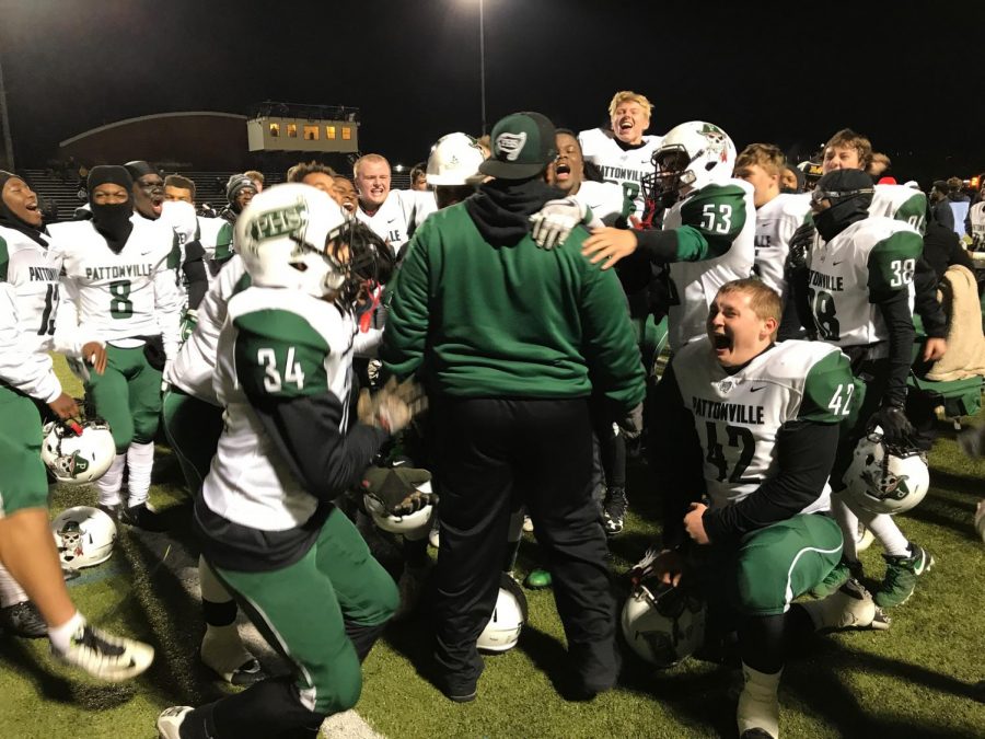 Coach Steve Smith celebrates the 34-27 victory against Vianney with his team after the game.