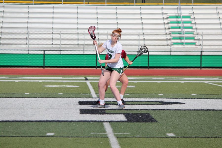Junior Helen Nelson wins a draw during a game at Pattonville.