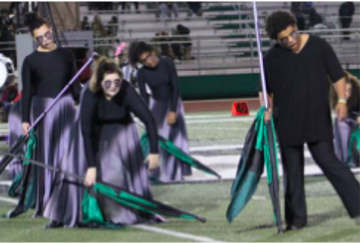 Color guard members participate in the 2017 marching band halftime show called 13 Paranormal Lane.