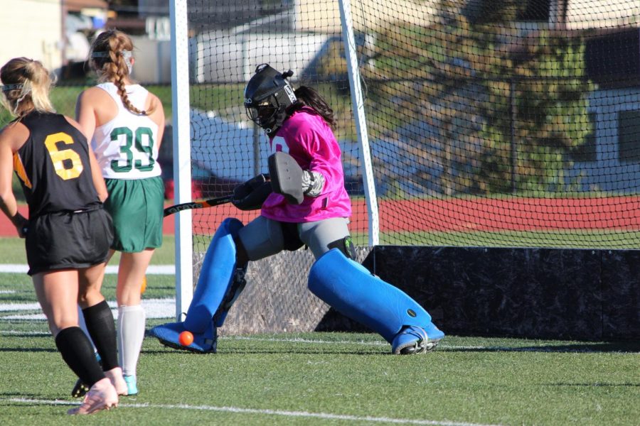Mikayla Bridges makes a foot save in the girls field hockey game on Senior Night against Oakville.
