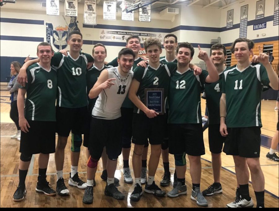 Boys varsity volleyball team holding their first place plaque at the Francis Howell Central touranment 