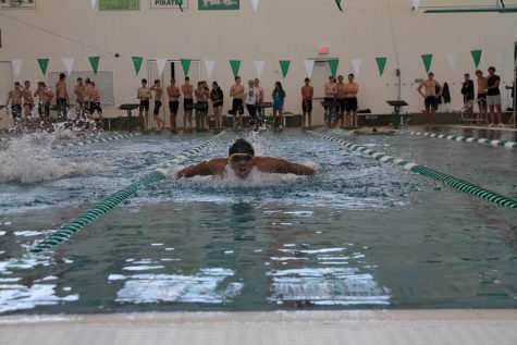 Spreading his wings, Philip Tso qualifies for state in the 100m butterfly.
