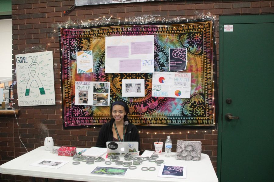 Xmiena Rogers sells bands and stickers to raise money for her wellness center. 