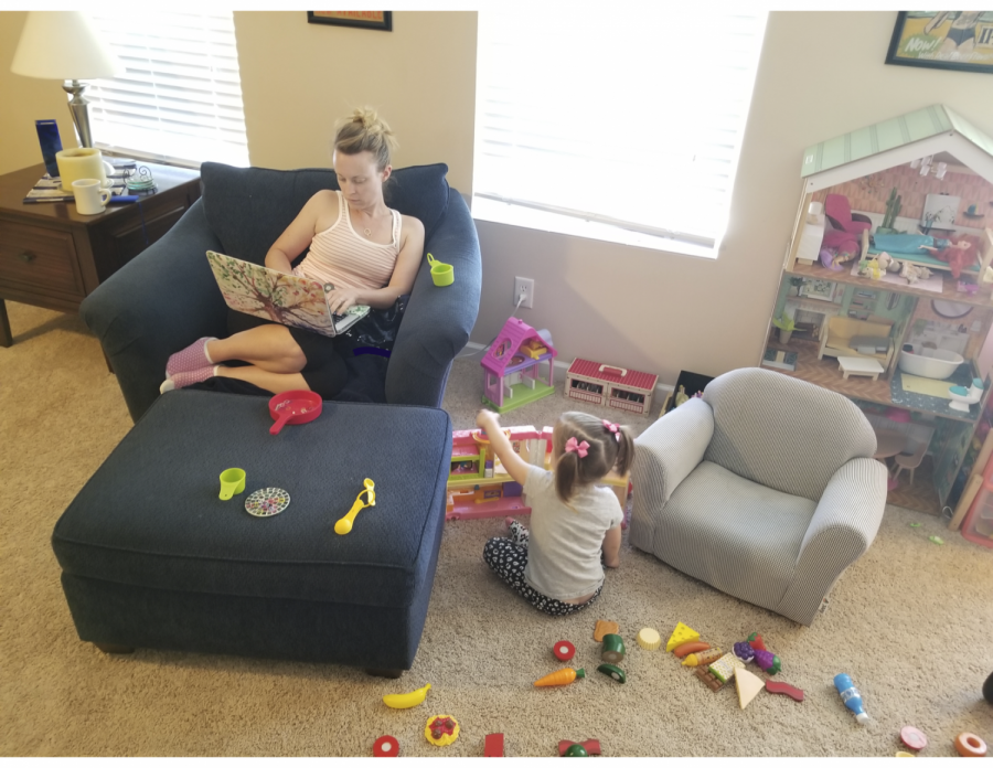 Ms. Kessler publishes her weekly lesson plans from home while her three year old daughter tries to get her attention. 