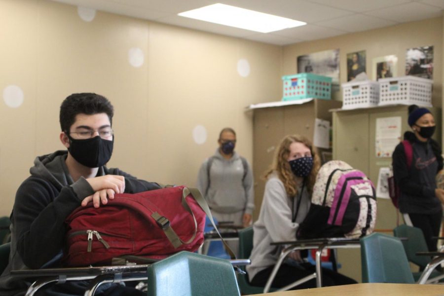 Reginald Carnemolla, Desire Adams, Jade Burgie, and Sheriyah Allen are putting on an example for the students returning back to school, as a  face mask is required, and the students and teachers are all socially distanced. 