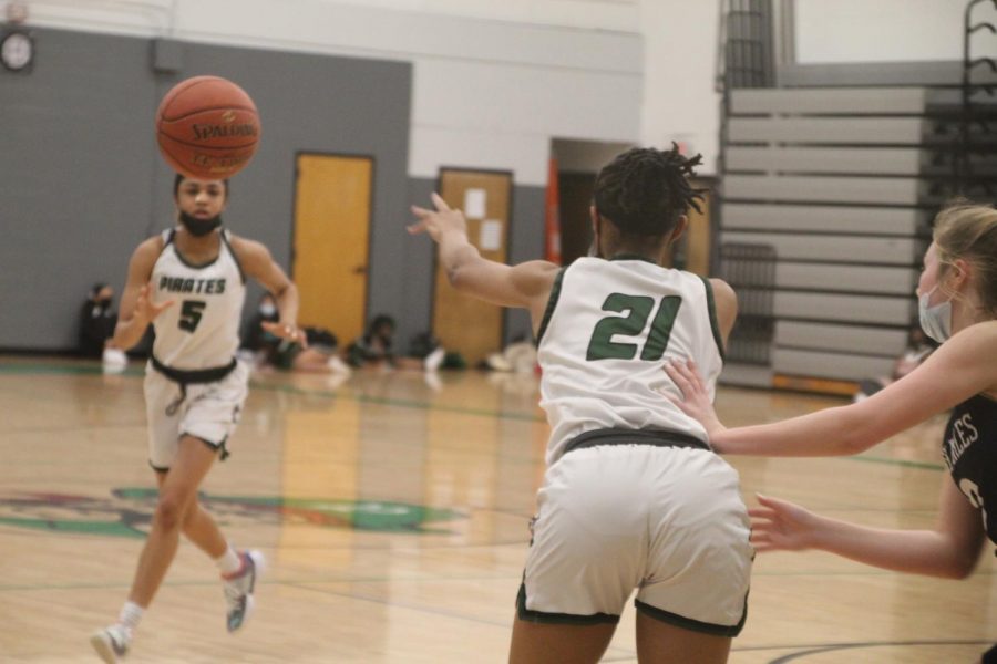 Alex Bullard passes the ball to her teammate, Jasmine Grey, in their game against St. Charles High on January 15th. 