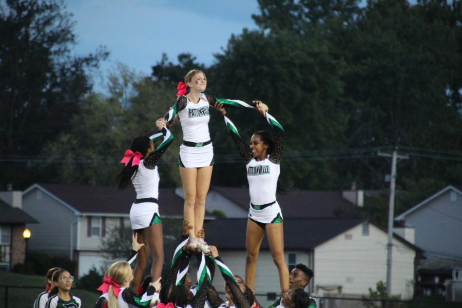 Cheer practices their stunts by performing at  Pattonville home football games. 