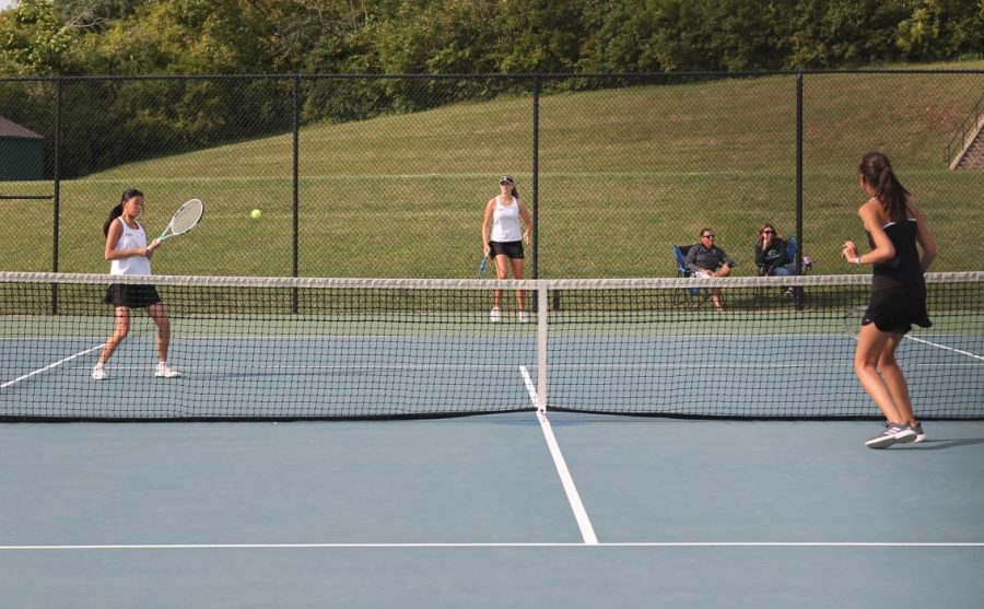 During a doubles match, players work together to figure out how to defeat their opponents. The girls faced Francis Howell North on September 24.