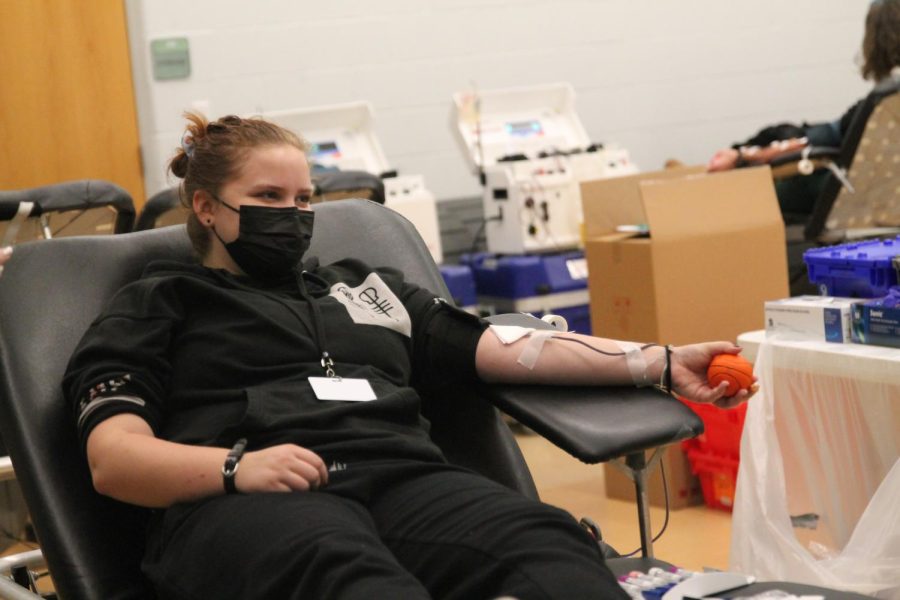 Senior+Lauren+Keller+donates+blood+to+American+Red+Cross+during+the+time+of+a+national+shortage.+The+blood+drive+was+sponsored+by+NHS.