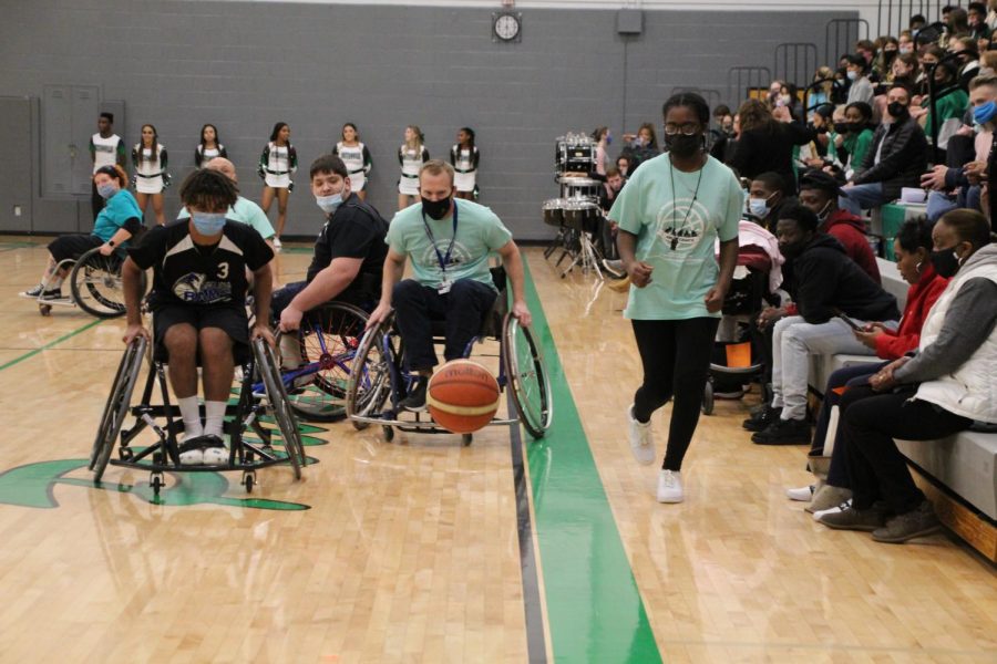 Assistant Principal Dr. Fitzgerald pushes to get the ball. The Jr. Rolling Rams were too tough of a match for the Pattonville team, however. Pattonville lost 44-18.