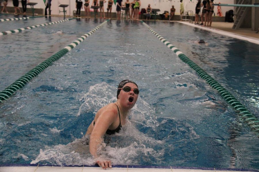 Emma Eiswirth gasps for a breath of air as she is doing her turn at a swim meet against Francis Howell 