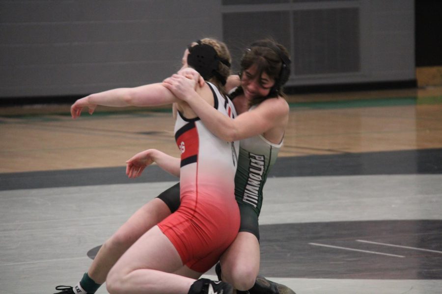 Junior Allison Basta attempts get an advantage on her opponent and get a pin in the match against Fox.