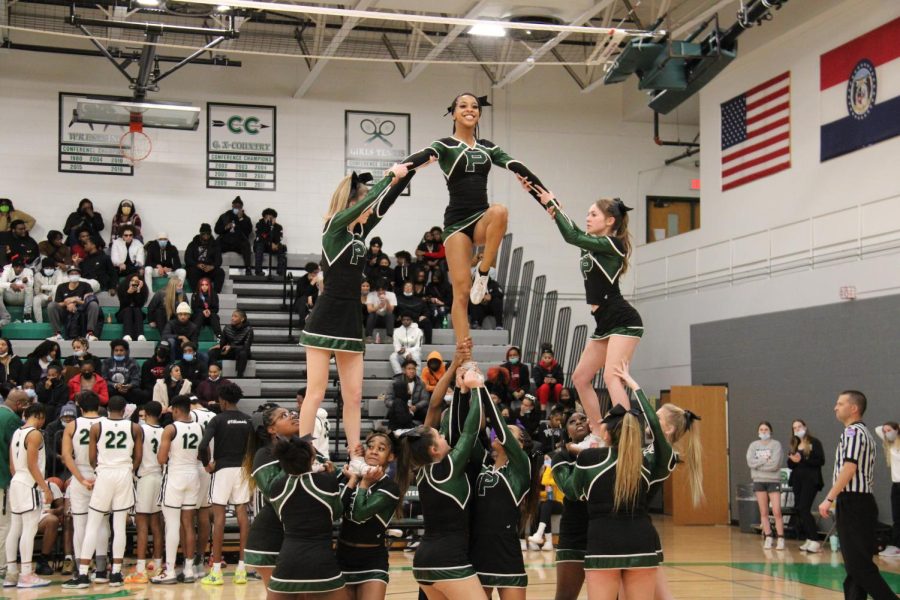 Varsity Cheer performs at a basketball game at Ladue High School. The team went on to place fourth at Nationals.