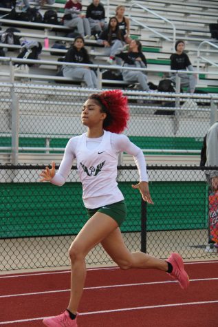 Junior Jasmine Grey runs for Girls’ Track during the JV Meet. They placed first at the All Suburban Red Conference in May and are moving onto the sectional competition. 