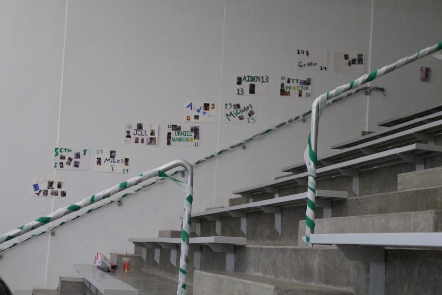 Before the game began, the underclassmen on the team stayed after school to make posters for the seniors with the pictures they submitted to the underclassmen. They also decorated the railings with green and white crepe paper in the stands where spectators sat. 