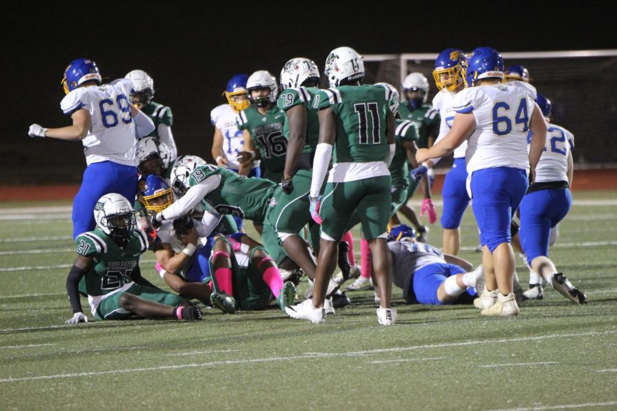 Pattonville Pirates tackle the Seckman Jaguars at the 30-yard-line. The Jaguars won the game, going into overtime with a score of 50-48.