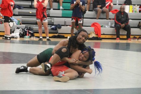 Jasmine Gordon successfully completes a cradle in her match against Ritenour High School. A cradle gives the wrestler two points and a method for a pin.