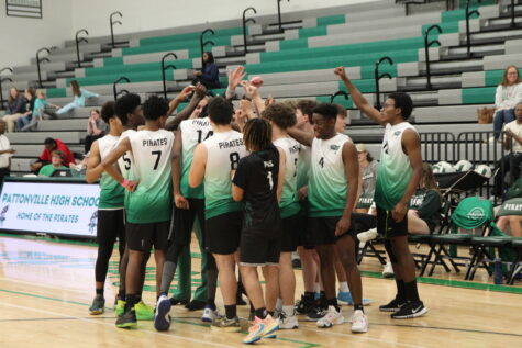 Pattonville’s Varsity Boys Volleyball huddle together during a timeout during their game against Hazelwood West. They finished that game with a 3-0 record.