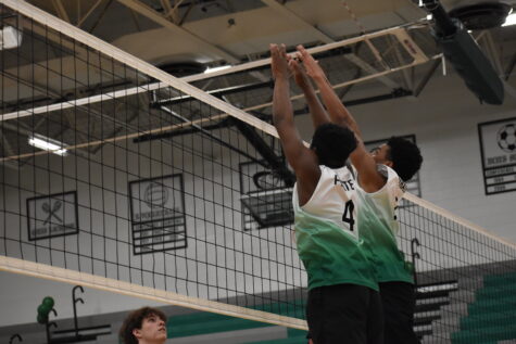 Del Michael Primus (7) and Isaiah White (4) go up for the block against Fort Zumwalt North on May 10th.