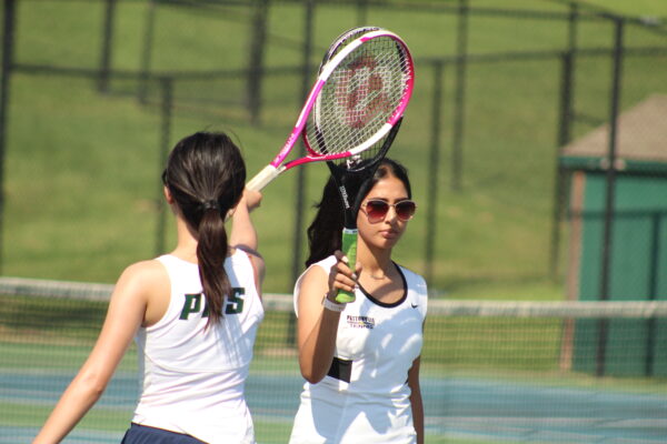 On August 28, the girls tennis team prepares for their first game of the season against Timberland.