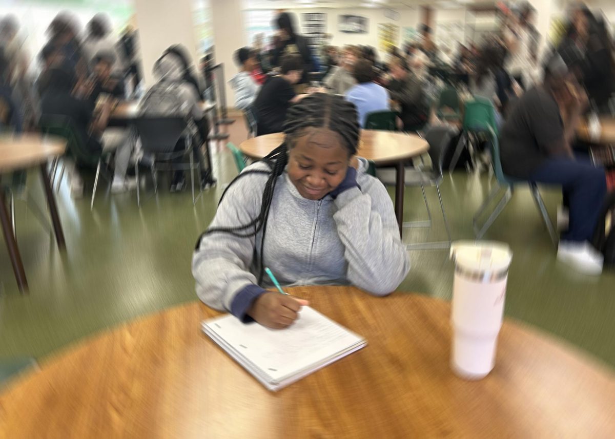 New student, junior Danielle Adory, sits at lunch. 