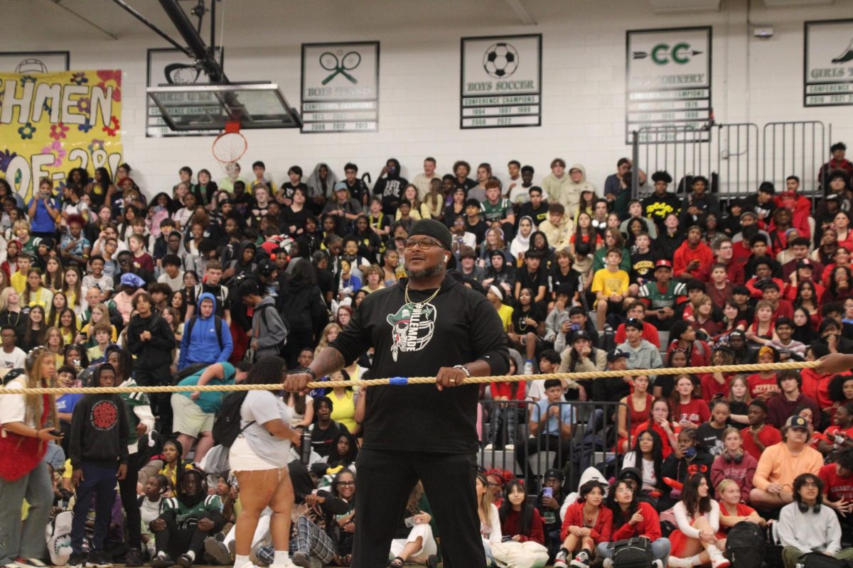Coach Steve Smith prepares to regulate the tug of war competition during the final showdown between the juniors and seniors. 