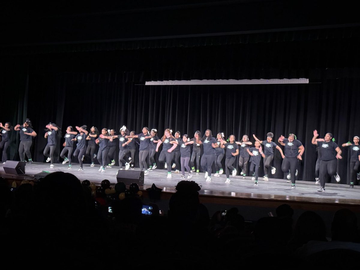 Members of Holman's step team perform. 