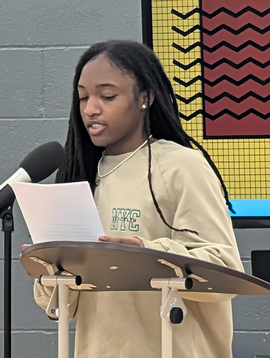 "We rose beyond the barriers set against us, finding beauty in a flawed system." Jamyra Blair wrote and presented a poem called "Black is the Color of Power" at the Read-In.