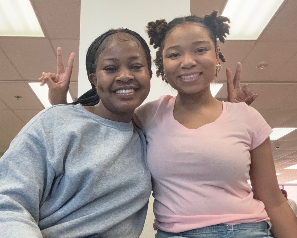 Staff writer Shauntavia Conway reconnects with junior Danielle Adory.  Both Shauntavia and Danielle were new to PHS this year. 