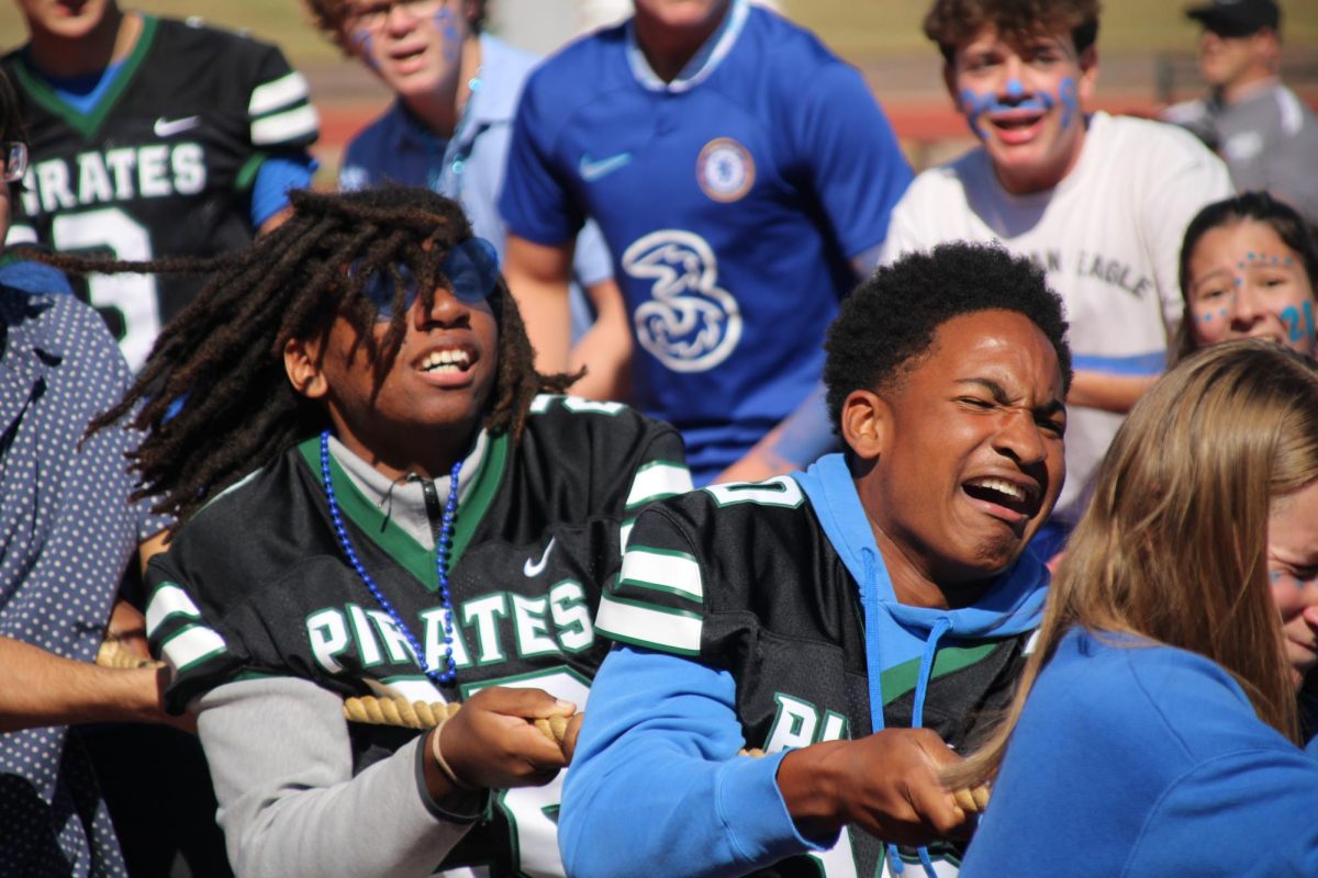 Deven Proudie (10) and Miles Smith (10) during the sophomore versus freshman tug of war game. The sophomores were ultimately disqualified after referee for the game, football coach Steve Smith, noticed that they had wrapped the rope around their bodies. 
